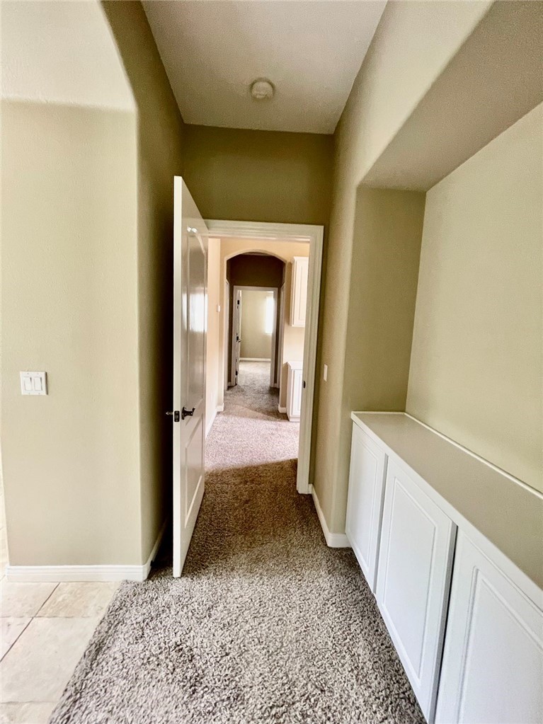 181 Rhapsody Irvine, CA 92620 - Photo 57 of 73 a view of a hallway view with wooden floor and a bathroom