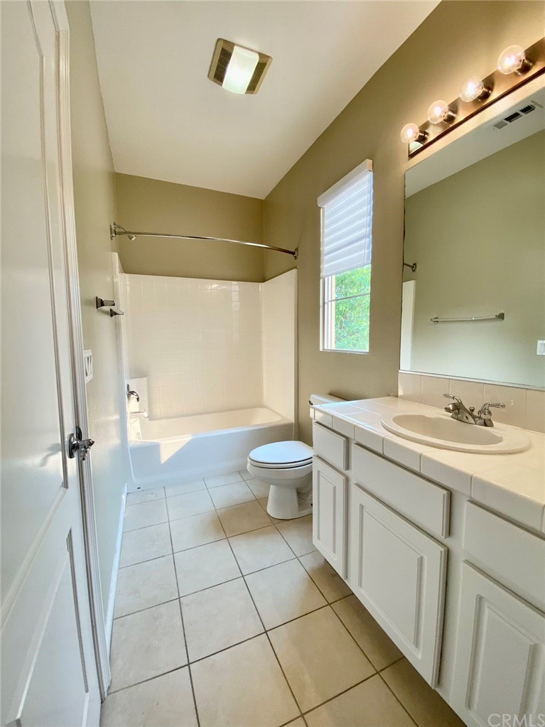 181 Rhapsody Irvine, CA 92620 - Photo 64 of 73 a spacious bathroom with a granite countertop sink a toilet and a shower