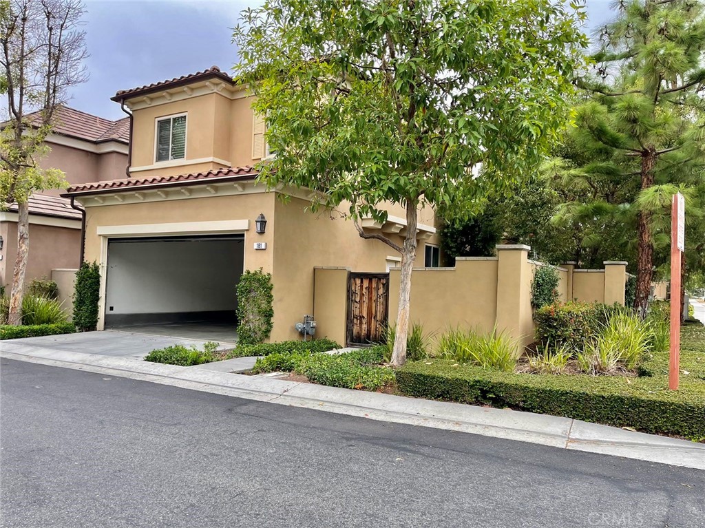 181 Rhapsody Irvine, CA 92620 - Photo 70 of 73 front view of a house with a yard and potted plants