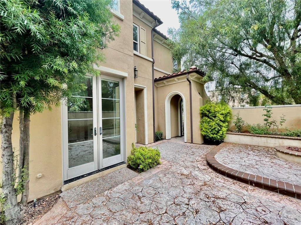 181 Rhapsody Irvine, CA 92620 - Photo 7 of 73 a view of a front door and a yard