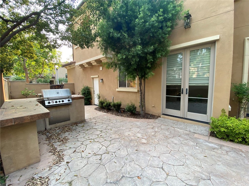 181 Rhapsody Irvine, CA 92620 - Photo 8 of 73 a backyard of a house with yard and outdoor seating