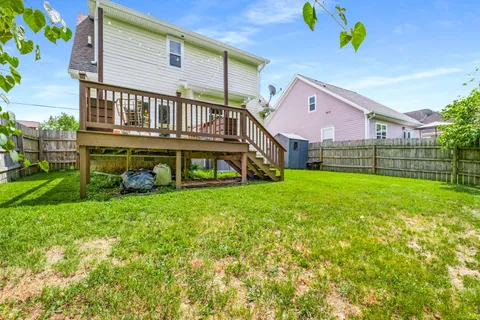 an aerial view of multiple houses with yard