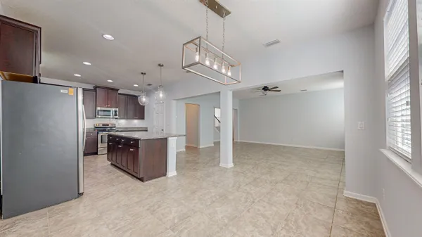 a view of an empty room with windows