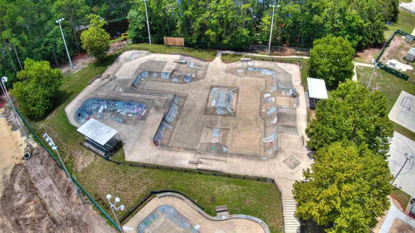 an aerial view of a house with a swimming pool