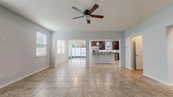a kitchen with stainless steel appliances granite countertop a sink refrigerator and cabinets