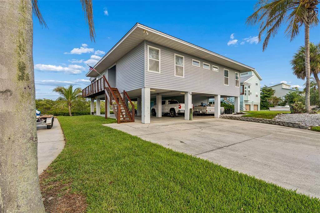 119 Burns Road Terra Ceia, FL 34250 - Photo 3 of 100 a front view of a house with a yard