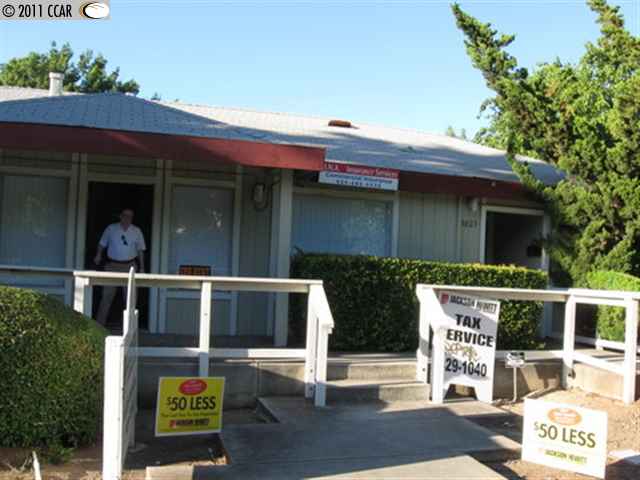 5023 Clayton Road Concord, CA 94521 - Photo 1 of 1 a front view of house with sign board