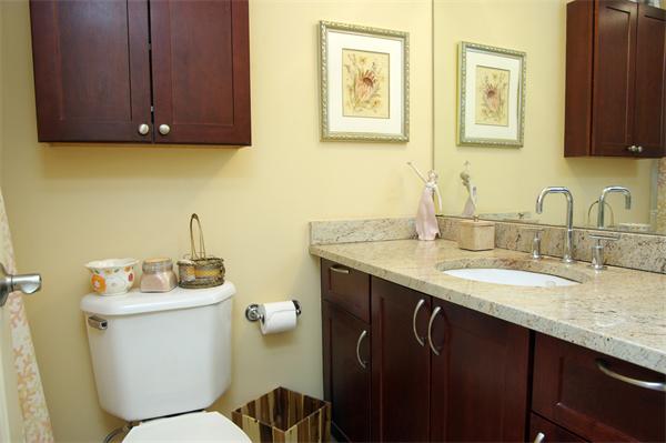 8 Museum Way, Unit 802 Cambridge, MA 02141 - Photo 10 of 13 a bathroom with a granite countertop toilet sink and mirror