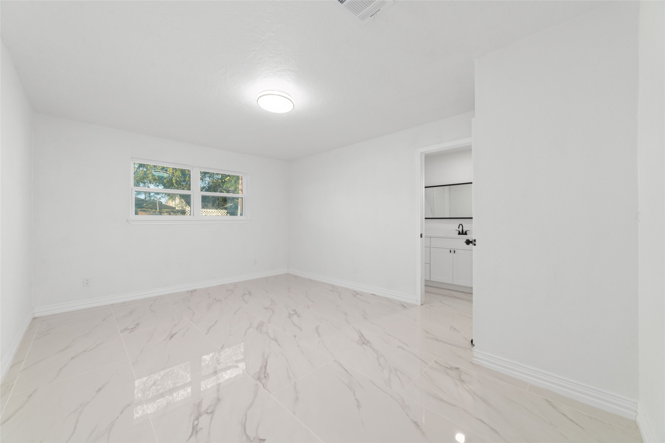 11434 Sharpview Drive Houston, TX 77072 - Photo 13 of 25 an empty room with windows