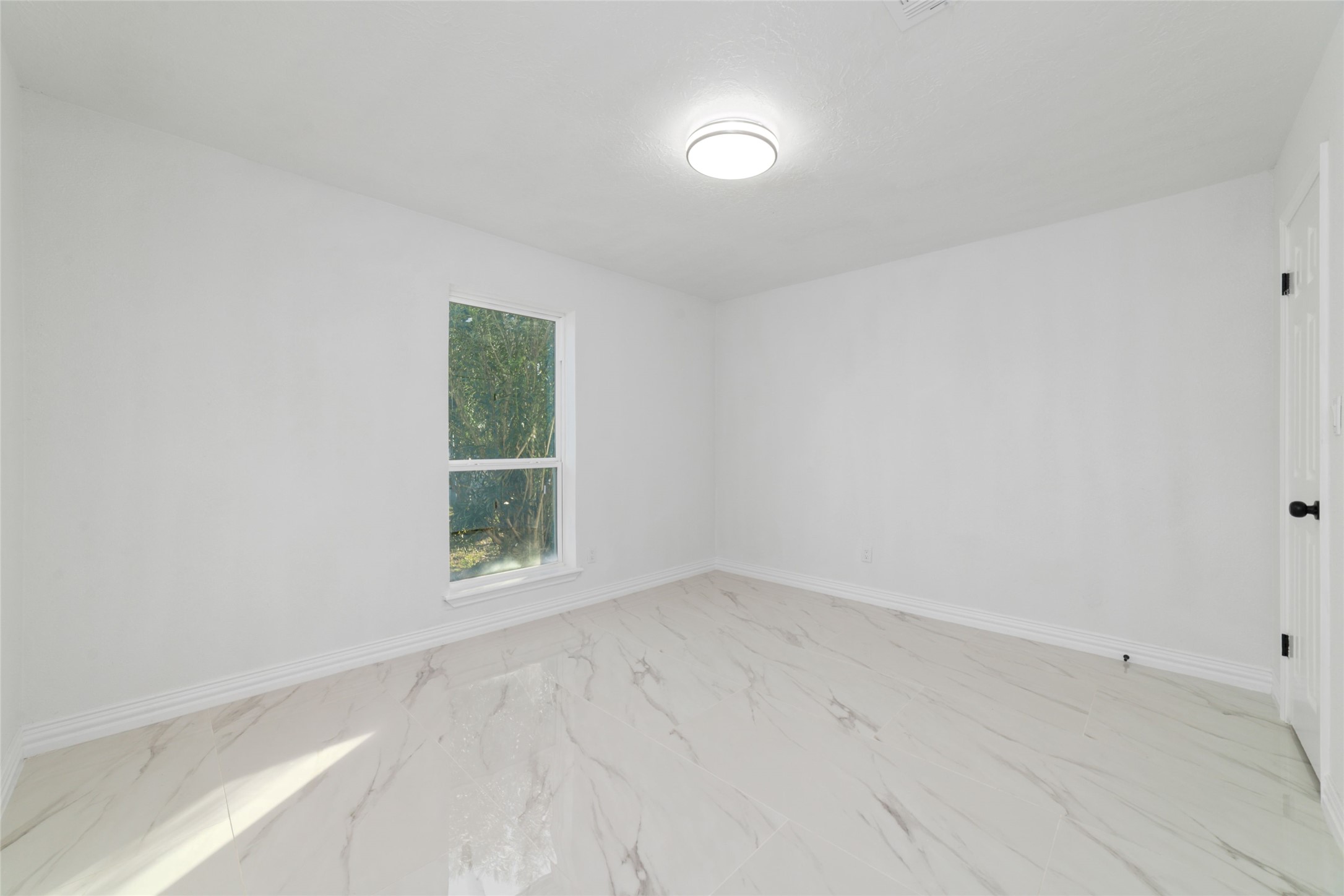 11434 Sharpview Drive Houston, TX 77072 - Photo 17 of 25 an empty room with a window