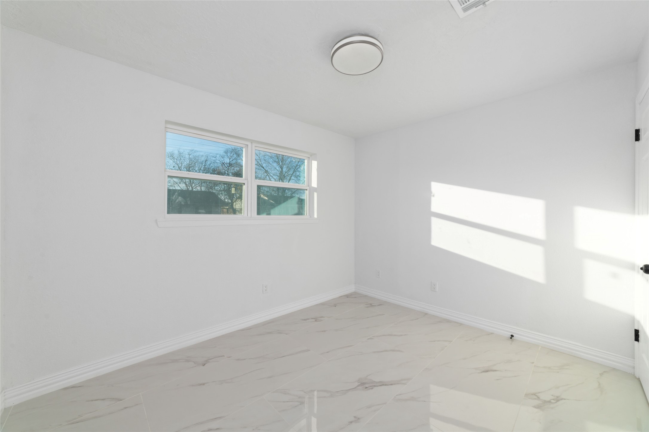 11434 Sharpview Drive Houston, TX 77072 - Photo 18 of 25 an empty room with a window