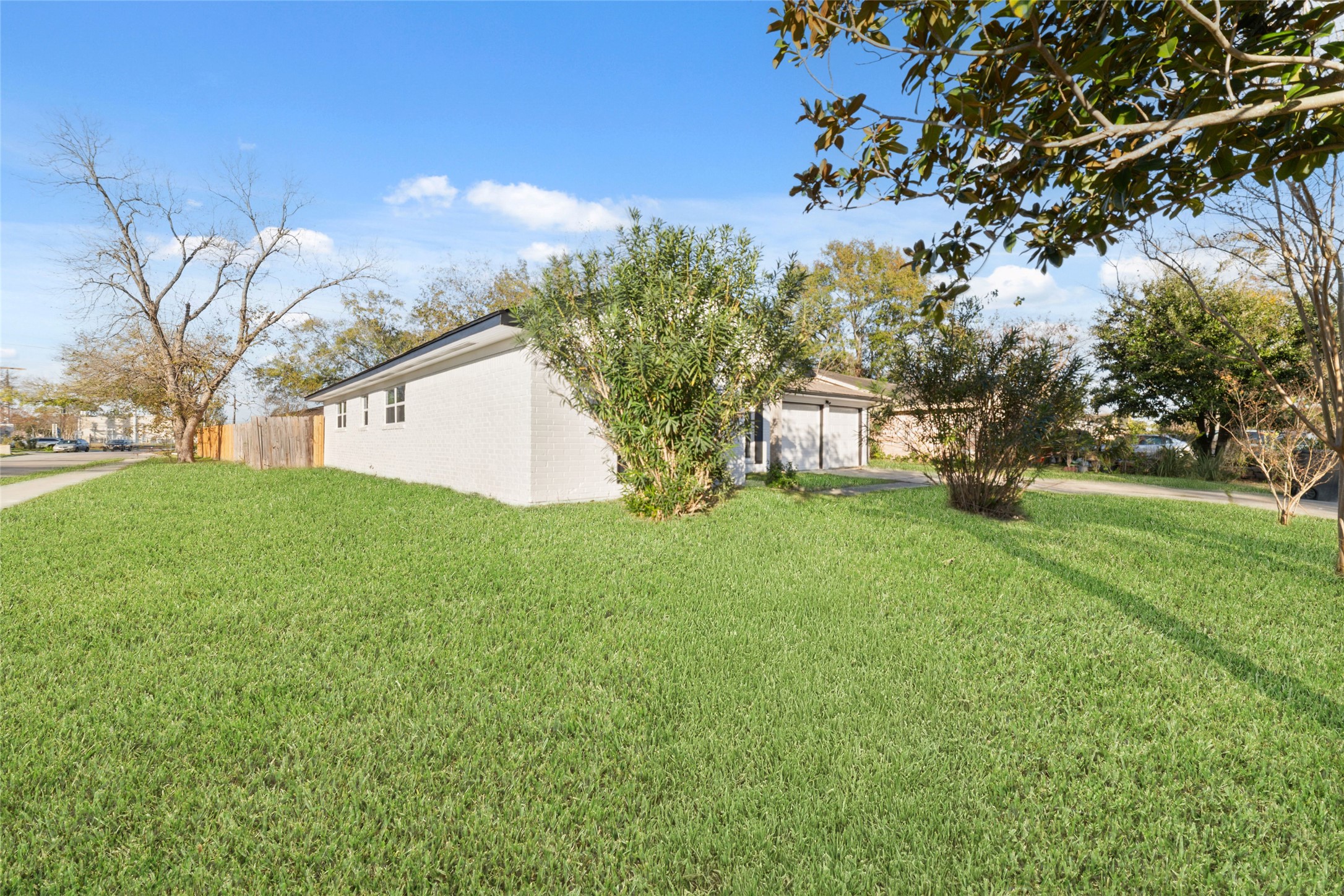11434 Sharpview Drive Houston, TX 77072 - Photo 2 of 25 a view of a house with backyard and tree