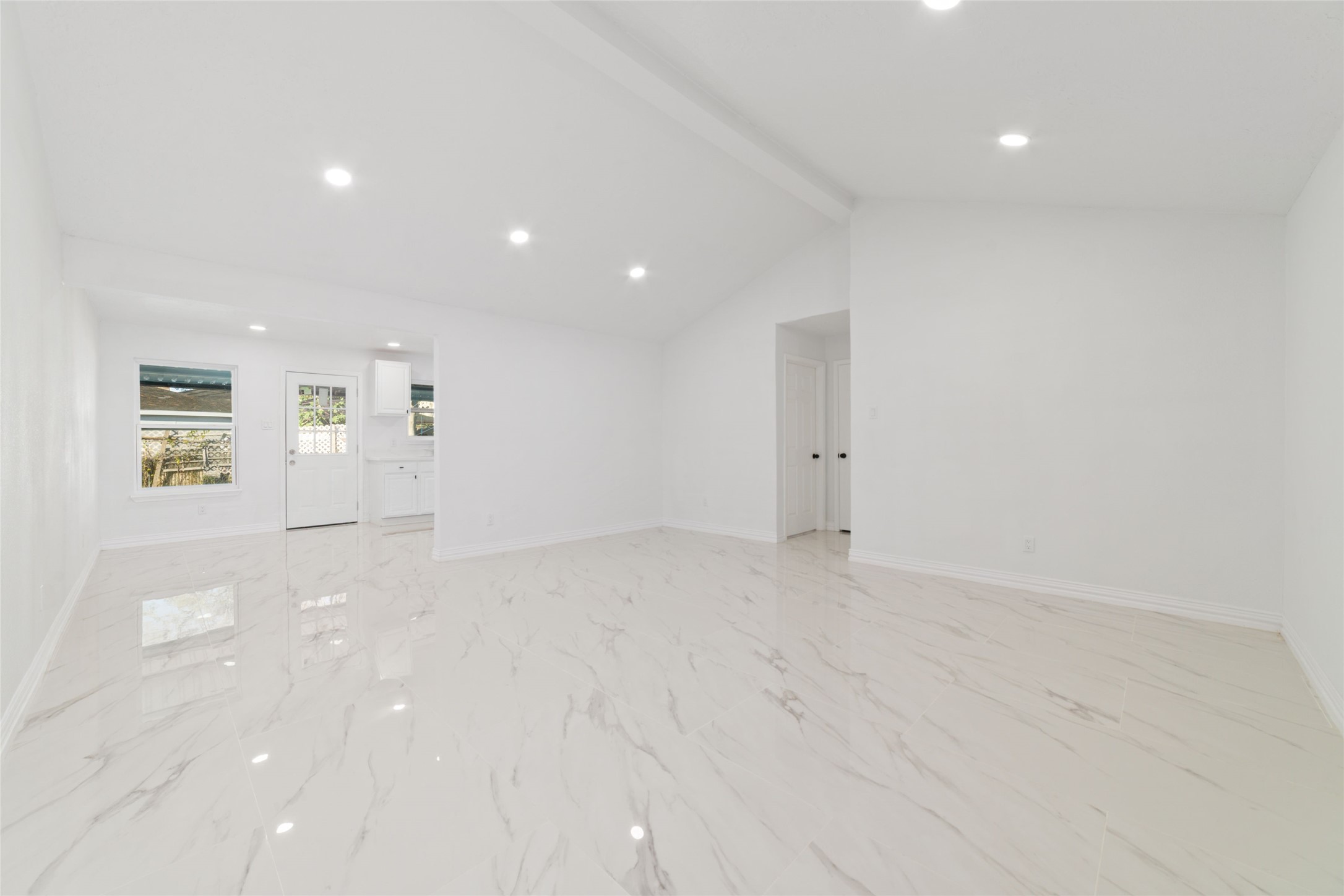 11434 Sharpview Drive Houston, TX 77072 - Photo 4 of 25 an empty room with white walls and windows