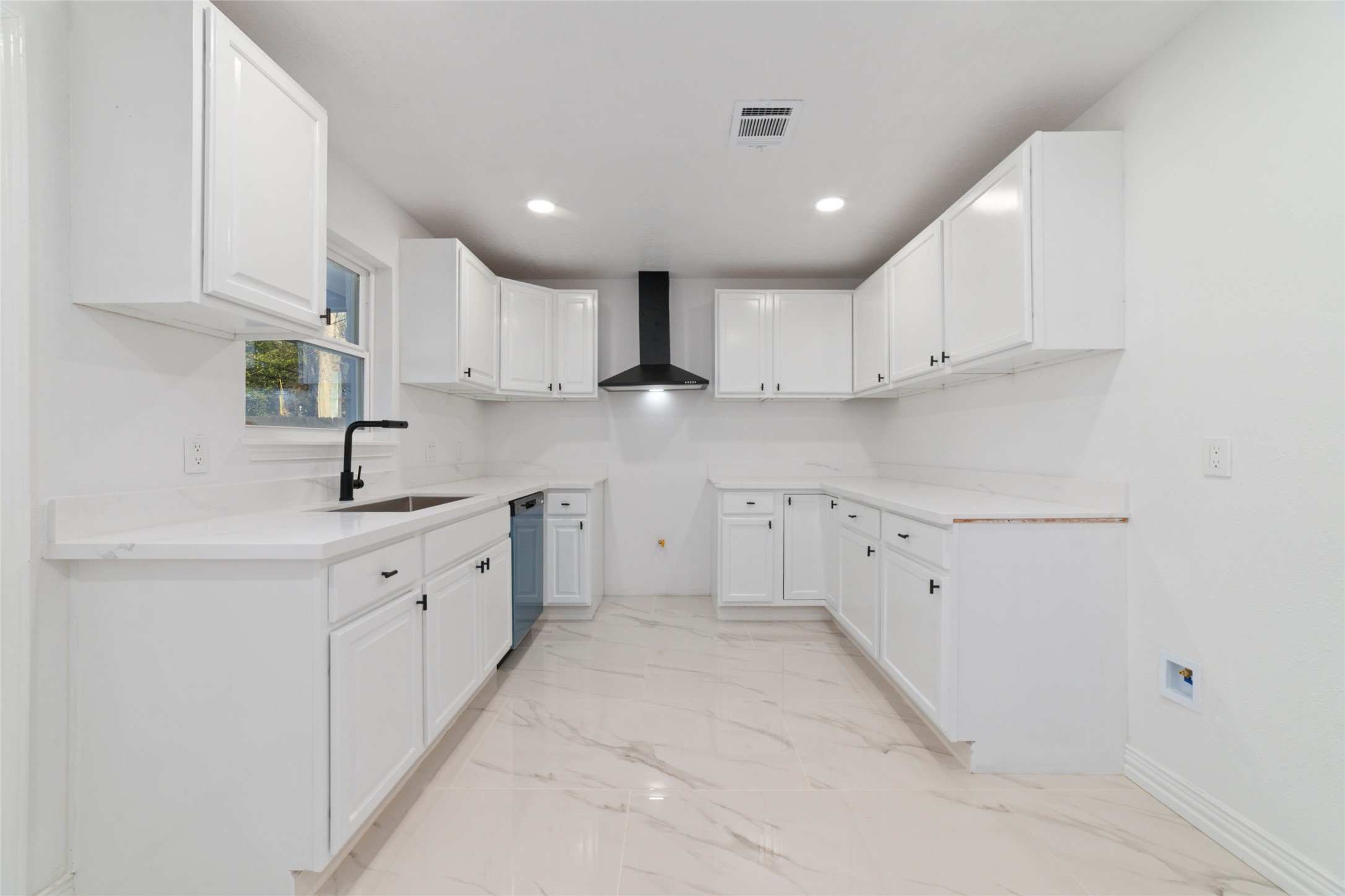 11434 Sharpview Drive Houston, TX 77072 - Photo 10 of 25 a kitchen with granite countertop white cabinets white stainless steel appliances with a sink and dishwasher