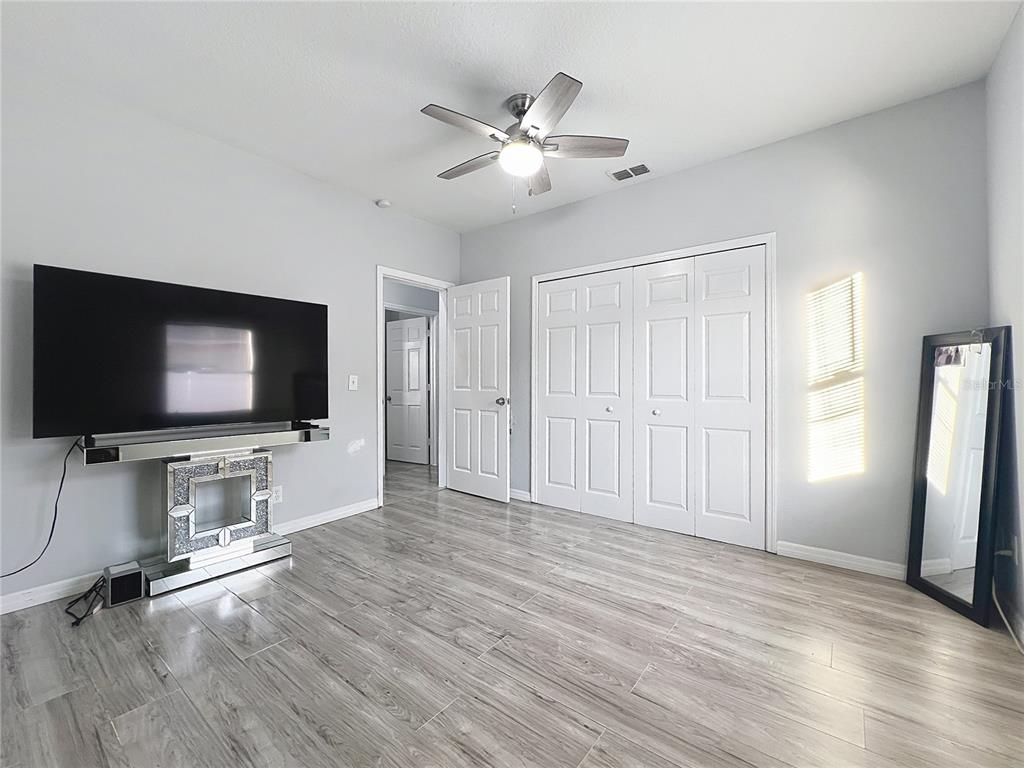 1109 5th Street Southwest Winter Haven, FL 33880 - Photo 14 of 20 a living room with furniture and flat screen tv