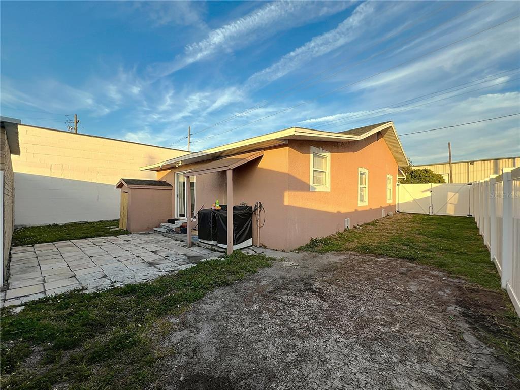 1109 5th Street Southwest Winter Haven, FL 33880 - Photo 20 of 20 a backyard of a house with plants and outdoor seating