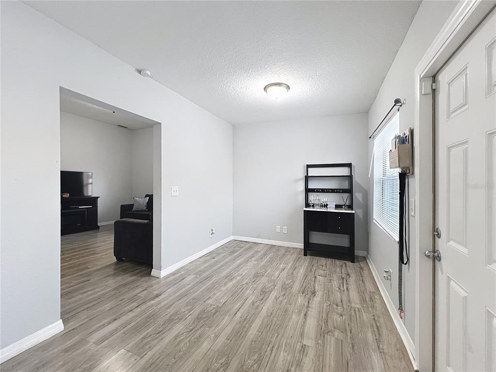 1109 5th Street Southwest Winter Haven, FL 33880 - Photo 4 of 20 wooden floor in an empty room