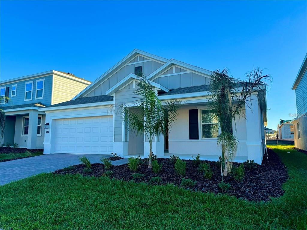 2693 Armstrong Avenue, Unit B Clermont, FL 34714 - Photo 2 of 10 a front view of a house with garden
