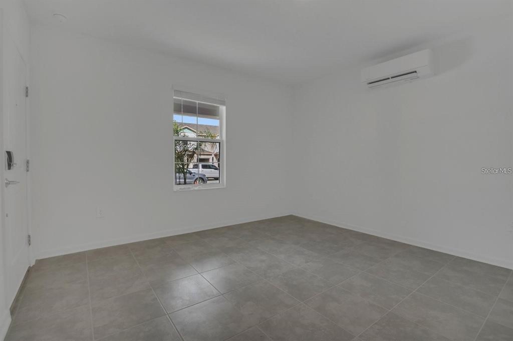 2693 Armstrong Avenue, Unit B Clermont, FL 34714 - Photo 5 of 10 an empty room with a window