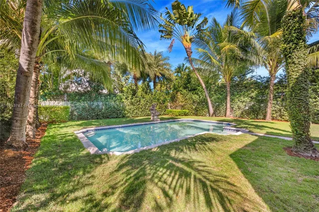 a view of swimming pool with a yard
