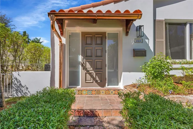 front view of a house with a small yard