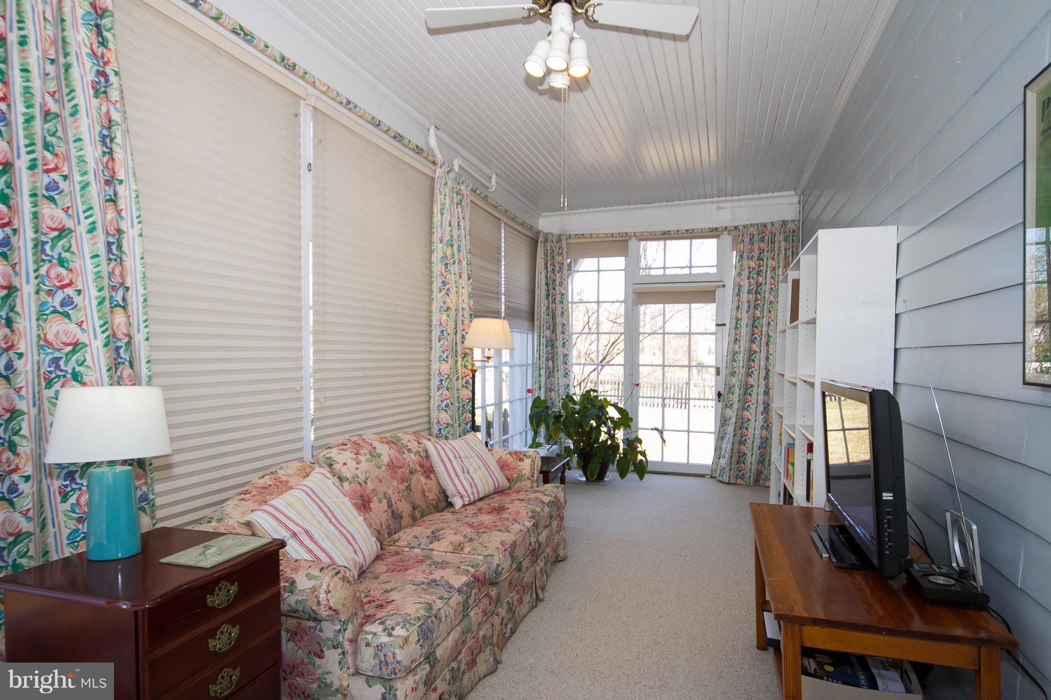 400 Hollen Road Baltimore, MD 21212 - Photo 13 of 29 Endless glass windows behind shades on Sunporch.