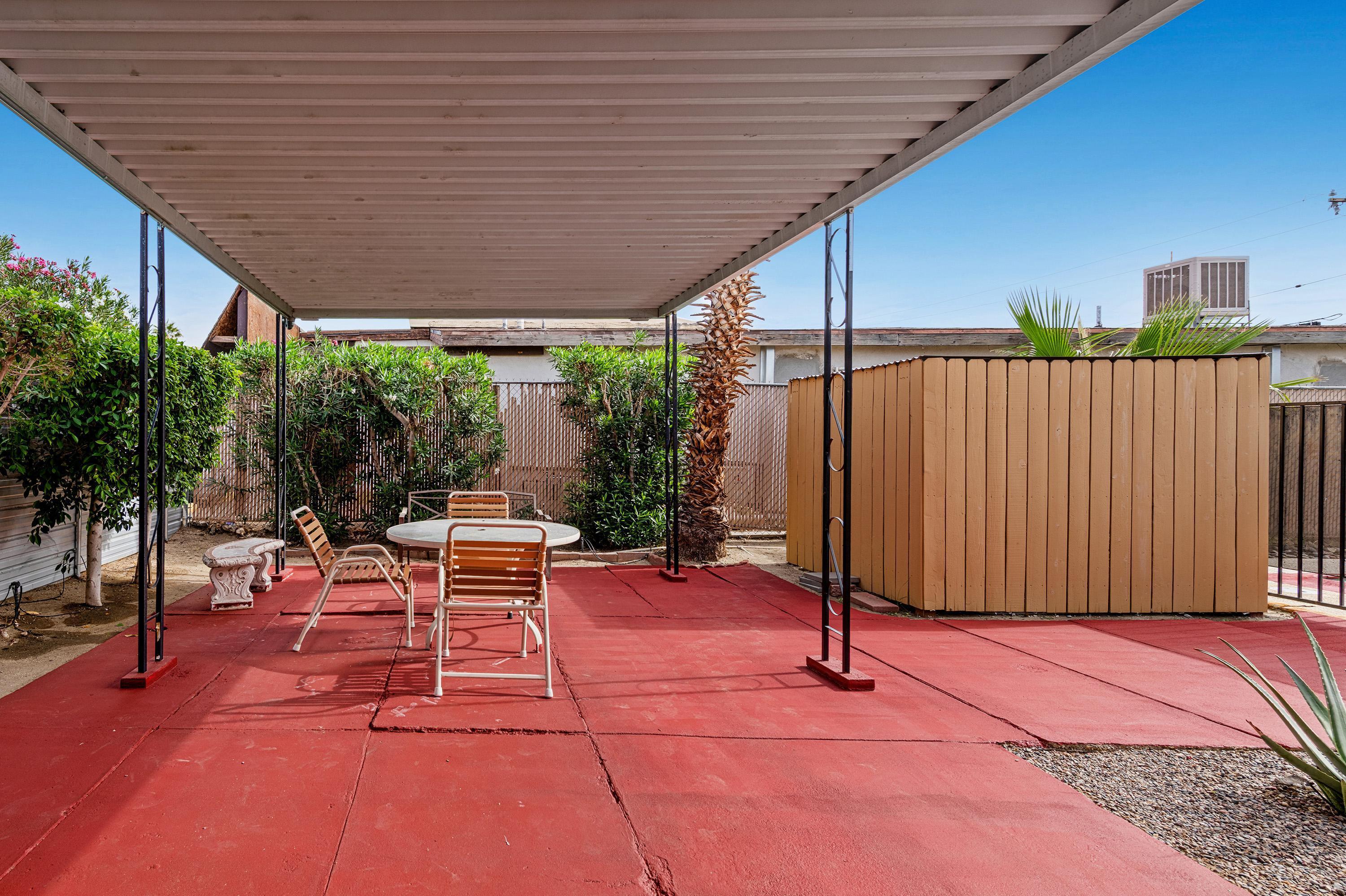66665 First Street Desert Hot Springs, CA 92240 - Photo 13 of 35 a patio with table and chairs