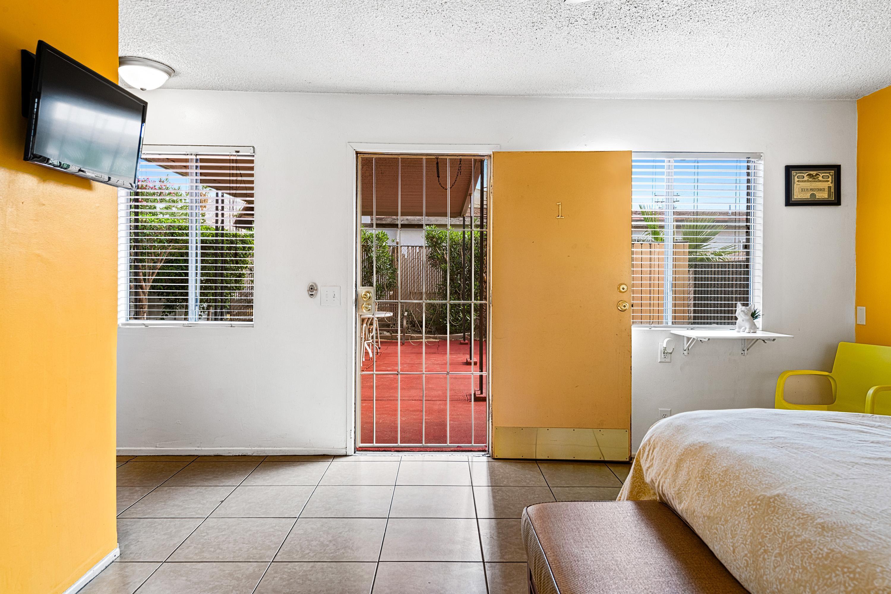 66665 First Street Desert Hot Springs, CA 92240 - Photo 18 of 35 a bedroom with a bed and flat screen tv