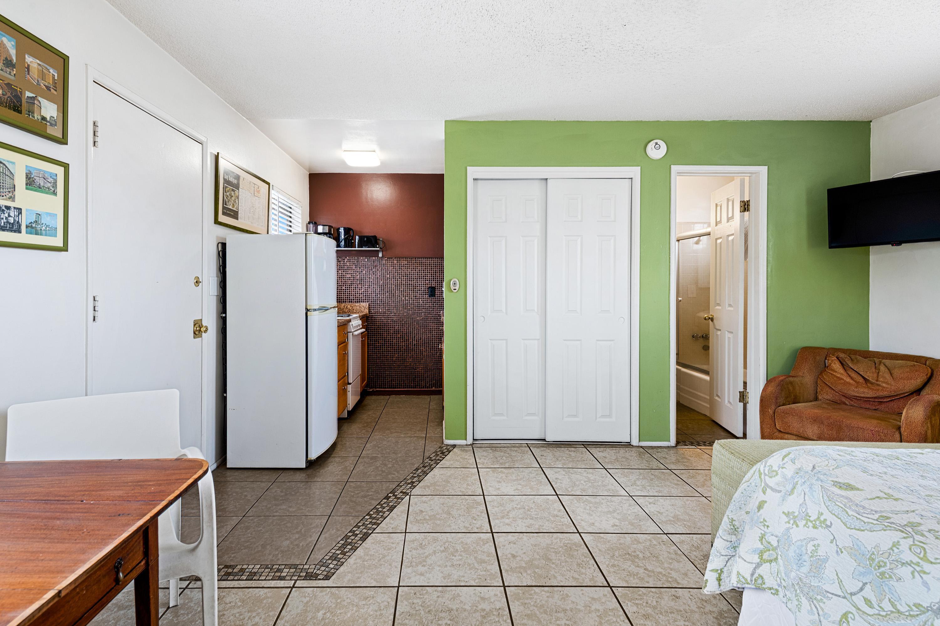 66665 First Street Desert Hot Springs, CA 92240 - Photo 23 of 35 a kitchen with stainless steel appliances granite countertop a refrigerator and a stove