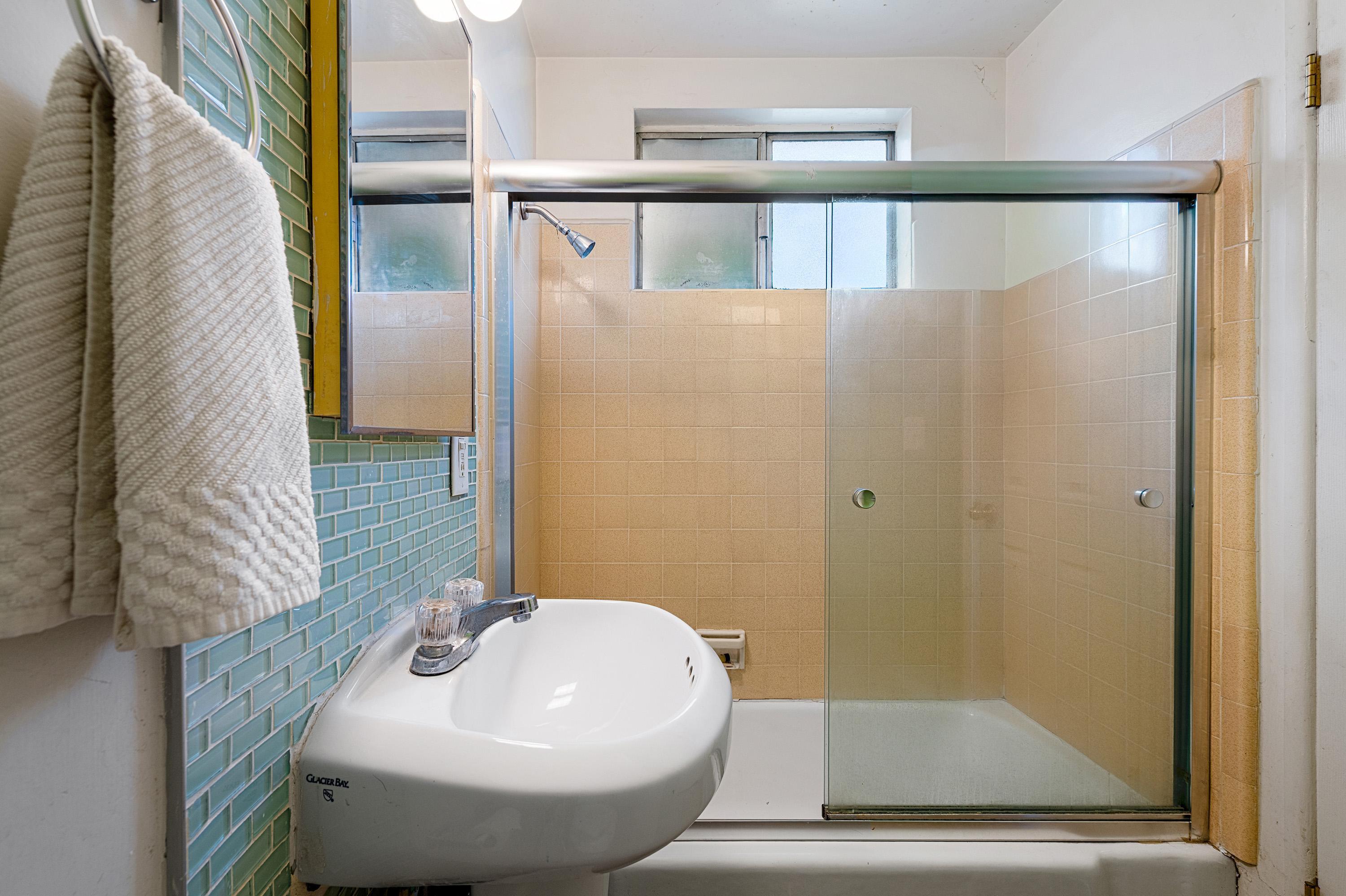 66665 First Street Desert Hot Springs, CA 92240 - Photo 25 of 35 a bathroom with a sink and a mirror