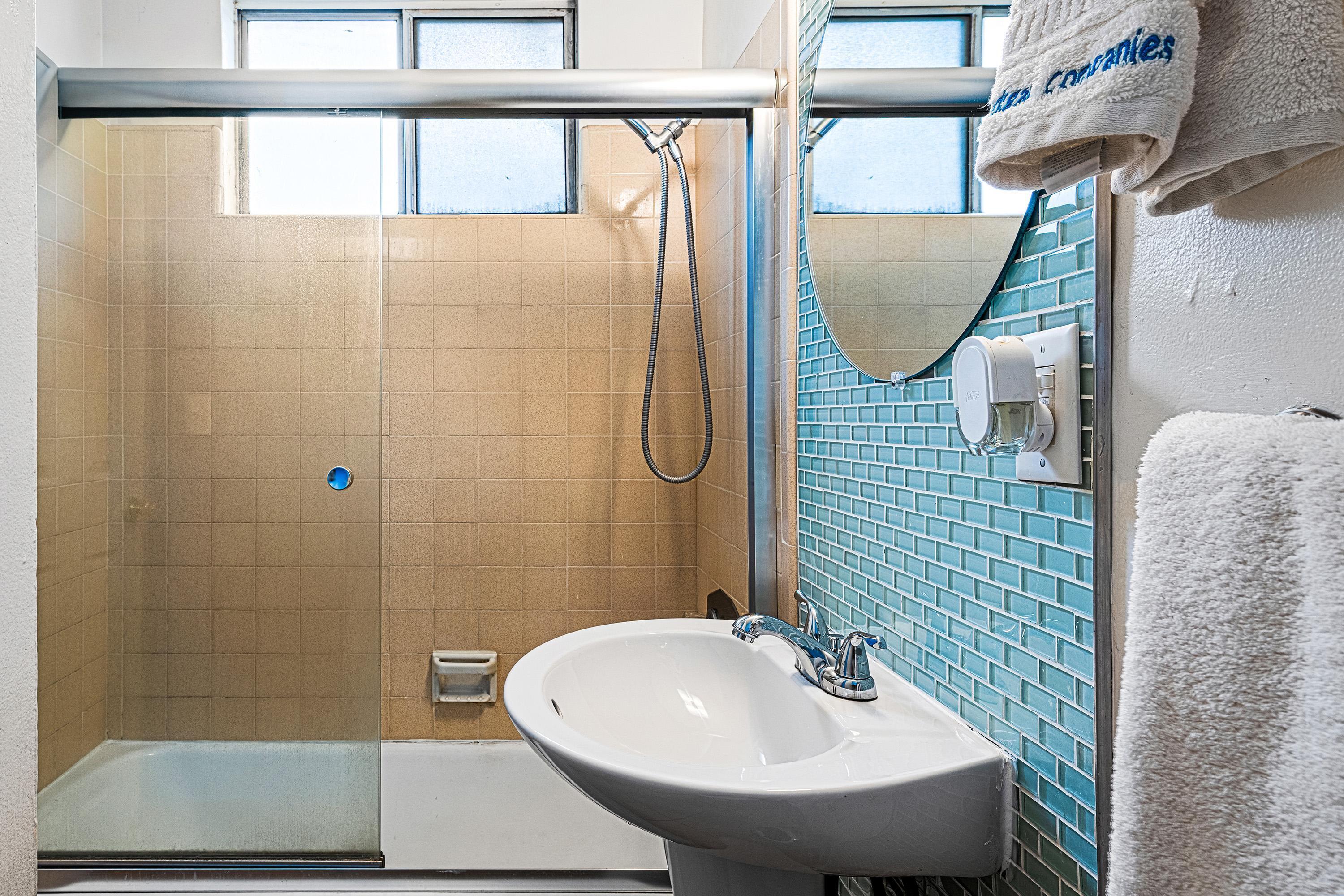 66665 First Street Desert Hot Springs, CA 92240 - Photo 29 of 35 a bathroom with a sink a mirror and a shower