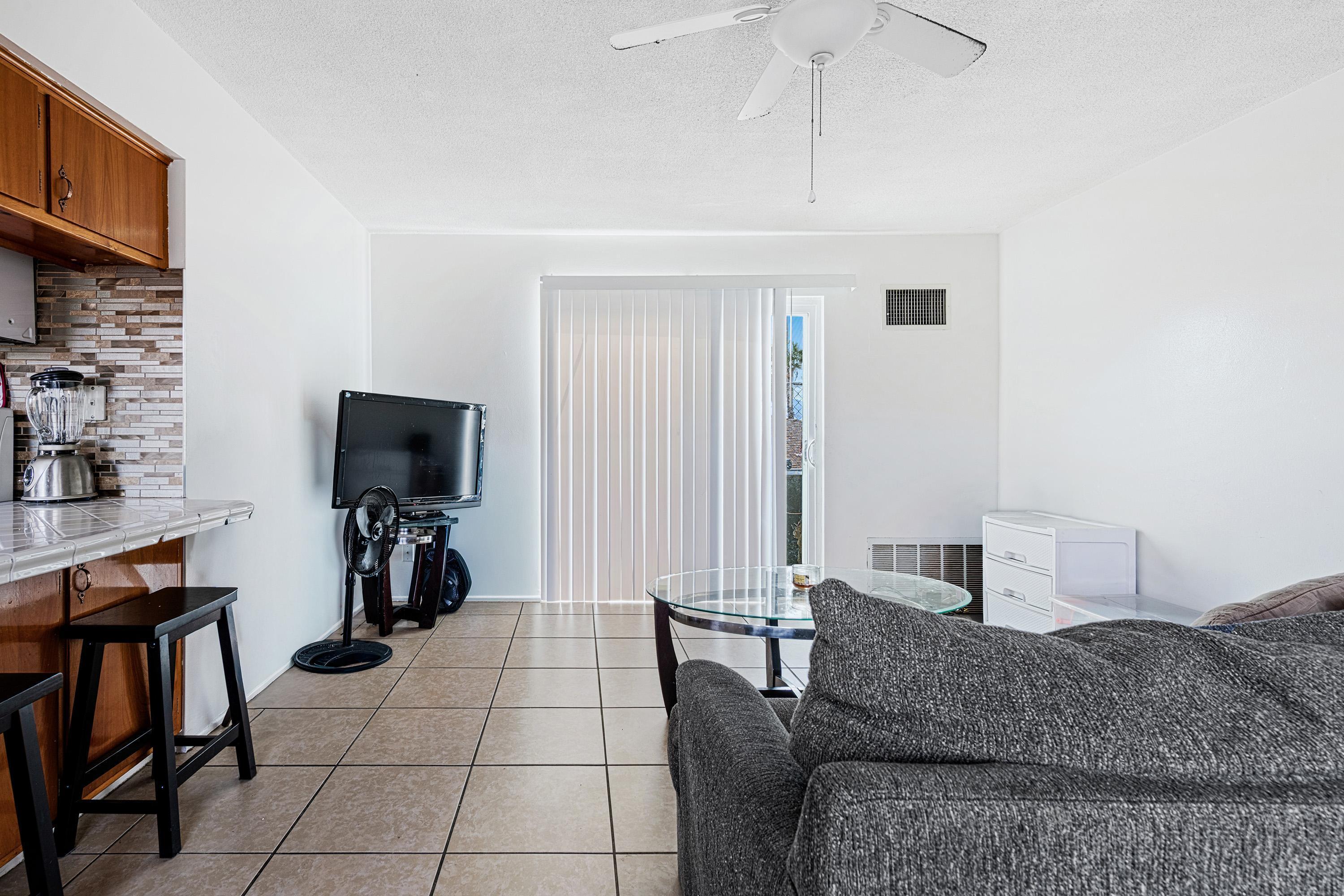 66665 First Street Desert Hot Springs, CA 92240 - Photo 30 of 35 a living room with furniture and a flat screen tv