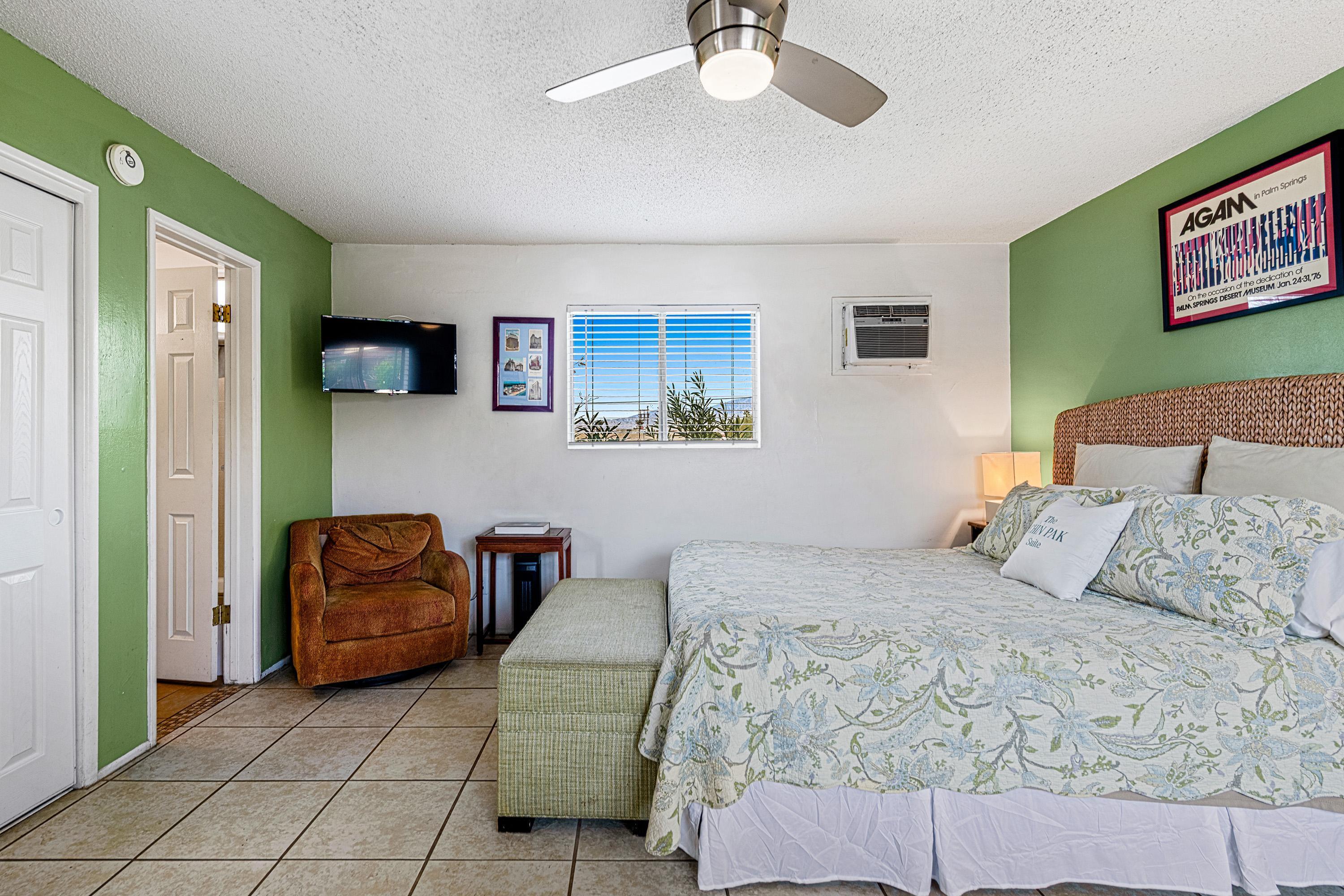 66665 First Street Desert Hot Springs, CA 92240 - Photo 6 of 35 a bedroom with a bed couch and painting on the wall