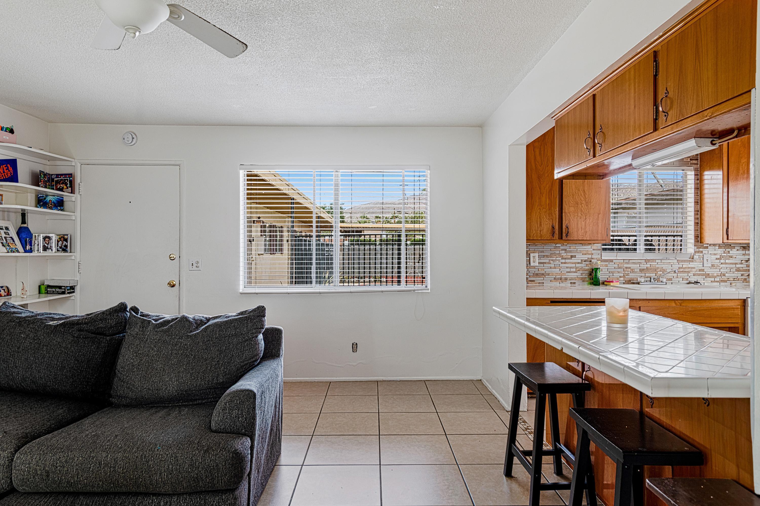 66665 First Street Desert Hot Springs, CA 92240 - Photo 8 of 35 a living room with furniture and a window