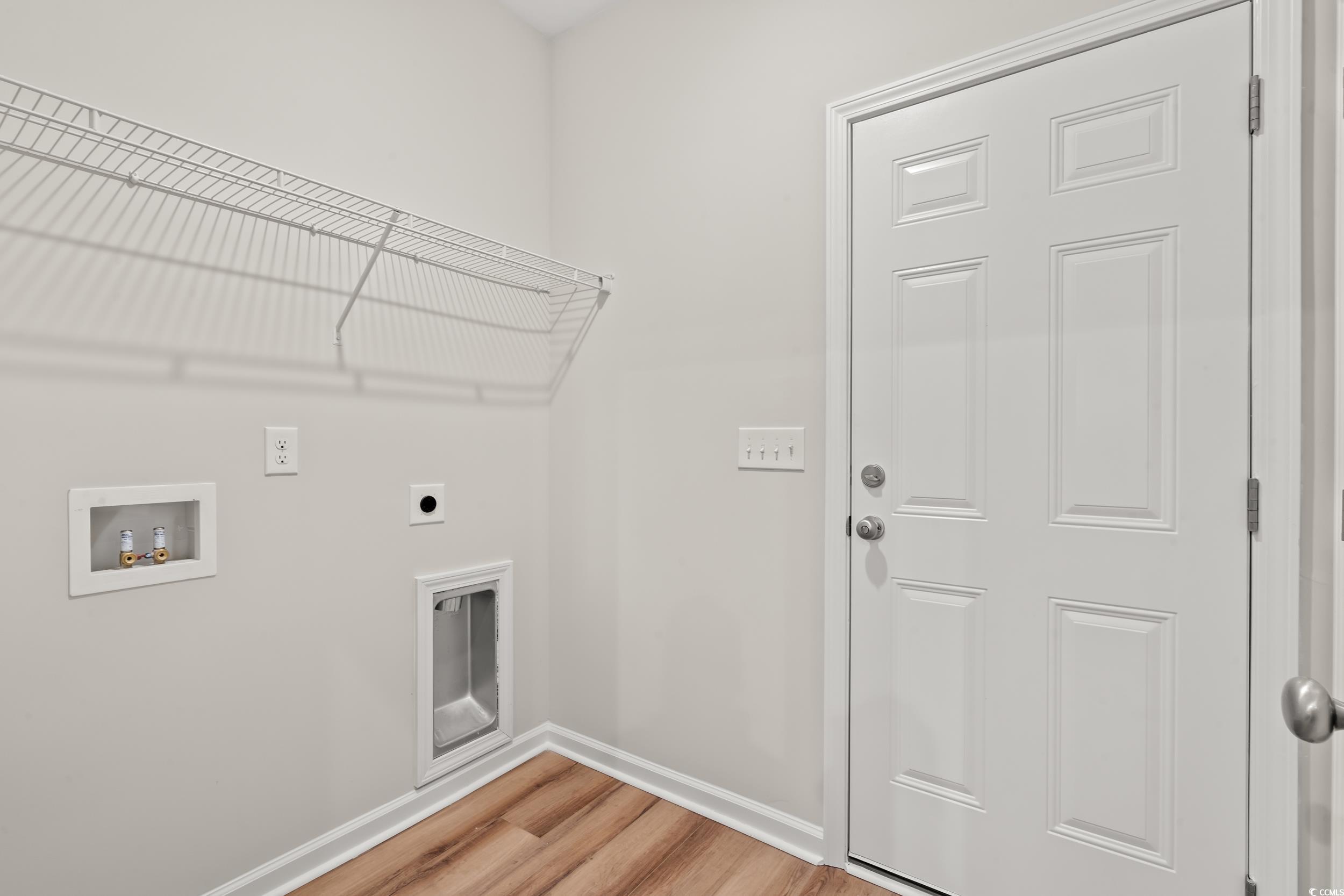 2315 Withers Street Georgetown, SC 29440 - Photo 12 of 29 Laundry room with light wood-style flooring, hookup for a washing machine, and electric dryer hookup