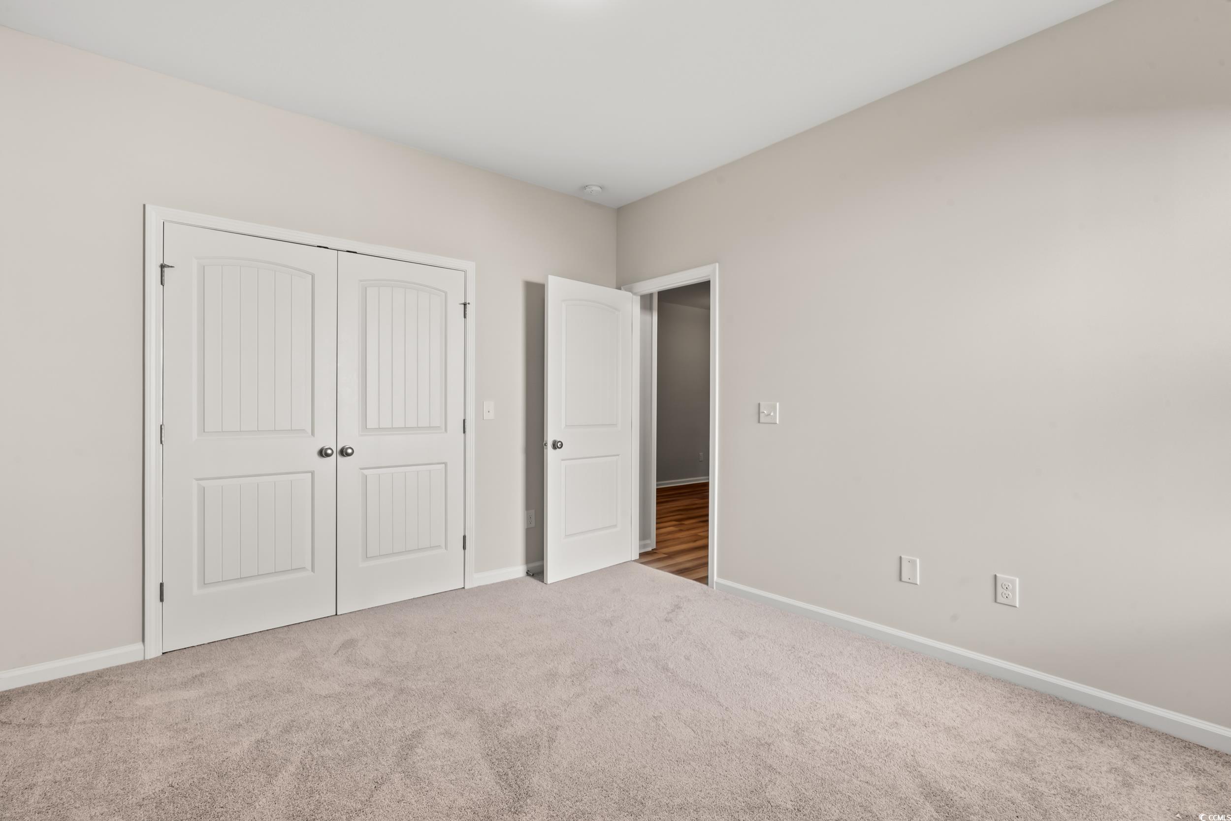 2315 Withers Street Georgetown, SC 29440 - Photo 13 of 29 Unfurnished bedroom with carpet flooring and a closet