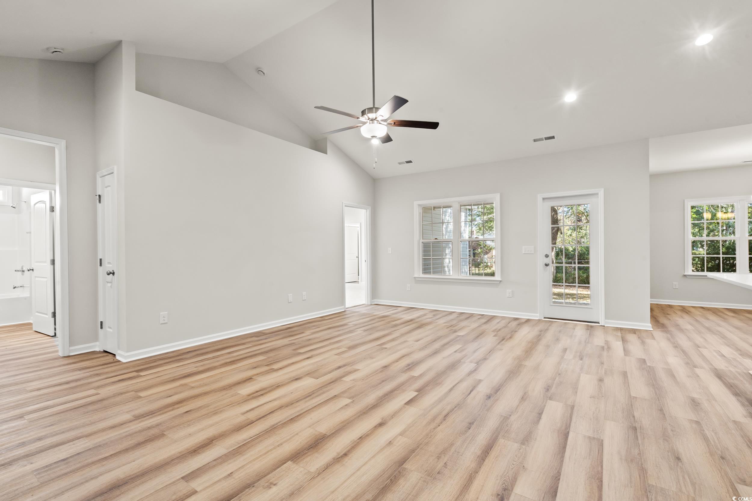 2315 Withers Street Georgetown, SC 29440 - Photo 3 of 29 Unfurnished living room with high vaulted ceiling, light wood-type flooring, ceiling fan, plenty of natural light, and recessed lighting