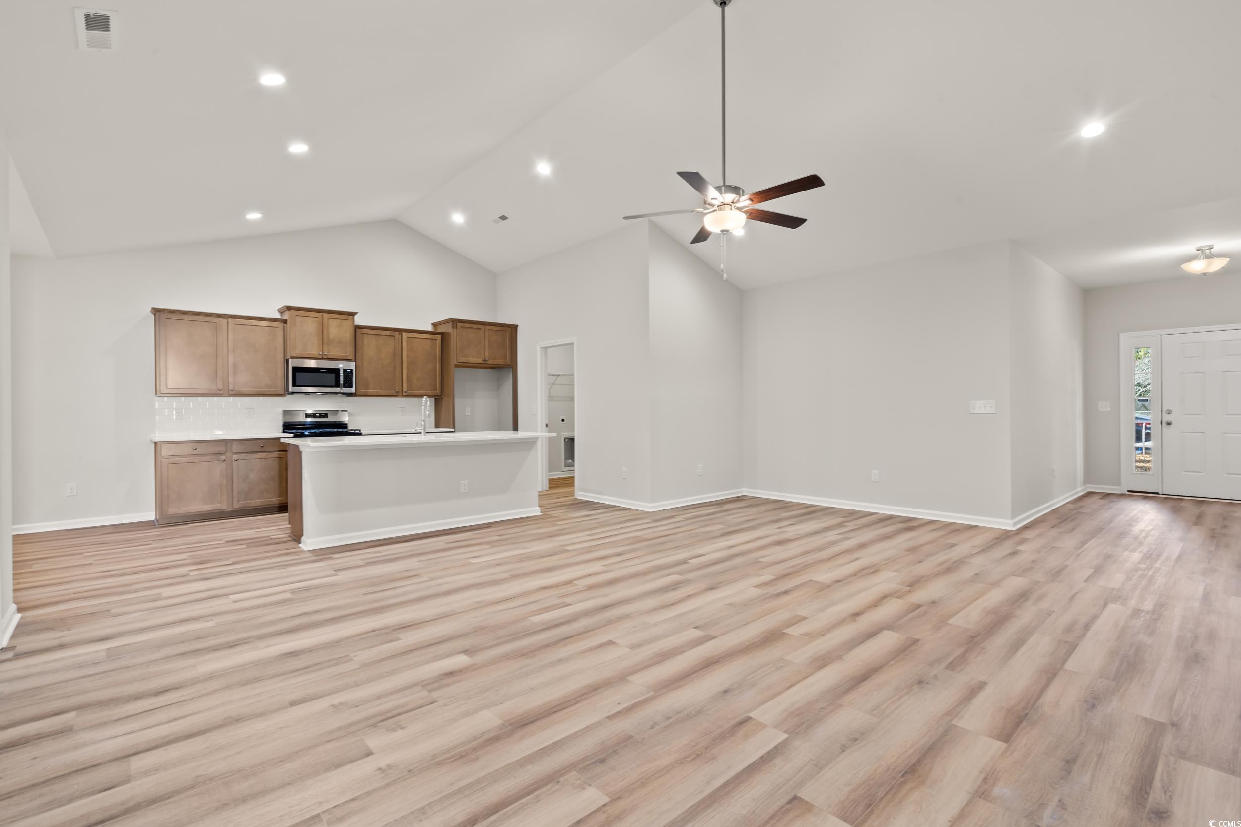 2315 Withers Street Georgetown, SC 29440 - Photo 8 of 29 Unfurnished living room featuring light wood finished floors, recessed lighting, ceiling fan, and high vaulted ceiling