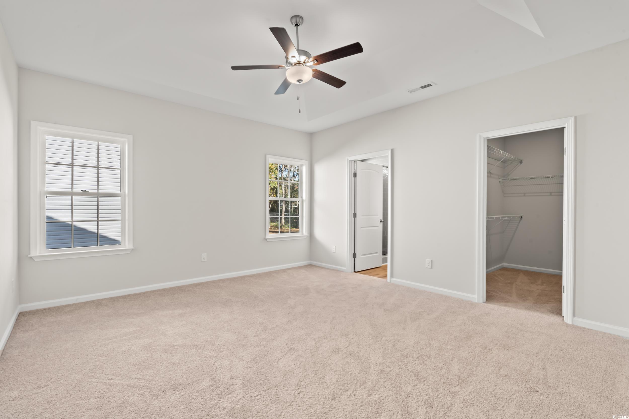 2315 Withers Street Georgetown, SC 29440 - Photo 10 of 29 Unfurnished bedroom with a spacious closet, light colored carpet, and ceiling fan