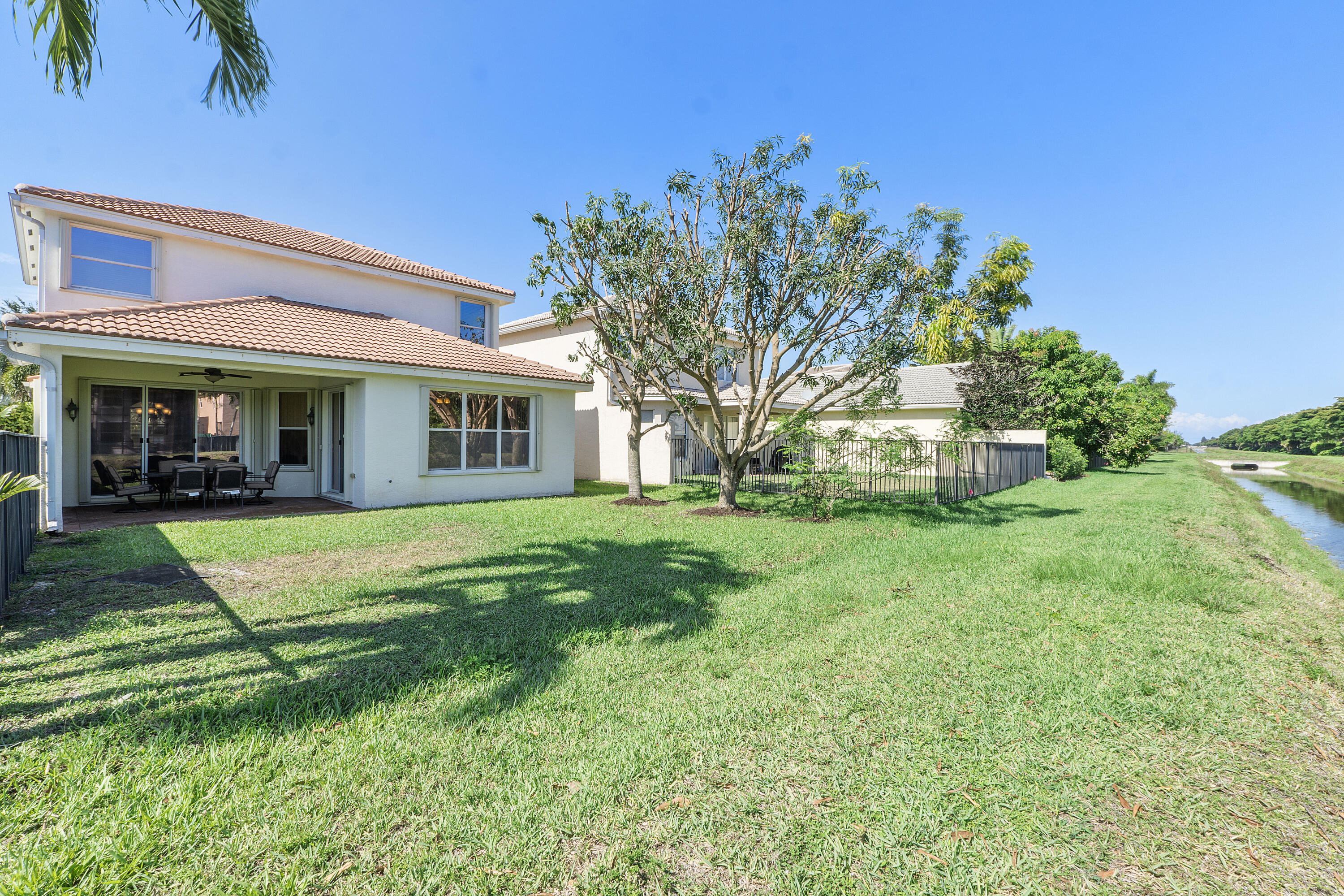 8936 Chestnut Ridge Way Boynton Beach, FL 33473 - Photo 11 of 50 Exterior backyard w fruit trees