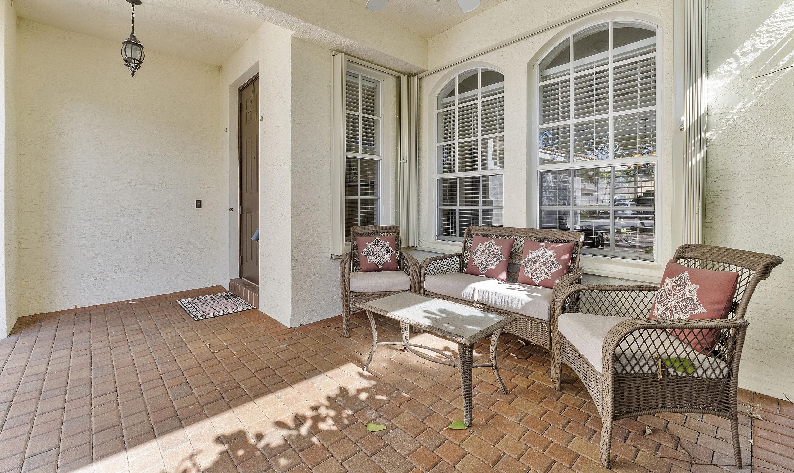 8936 Chestnut Ridge Way Boynton Beach, FL 33473 - Photo 4 of 50 Covered front porch seating area