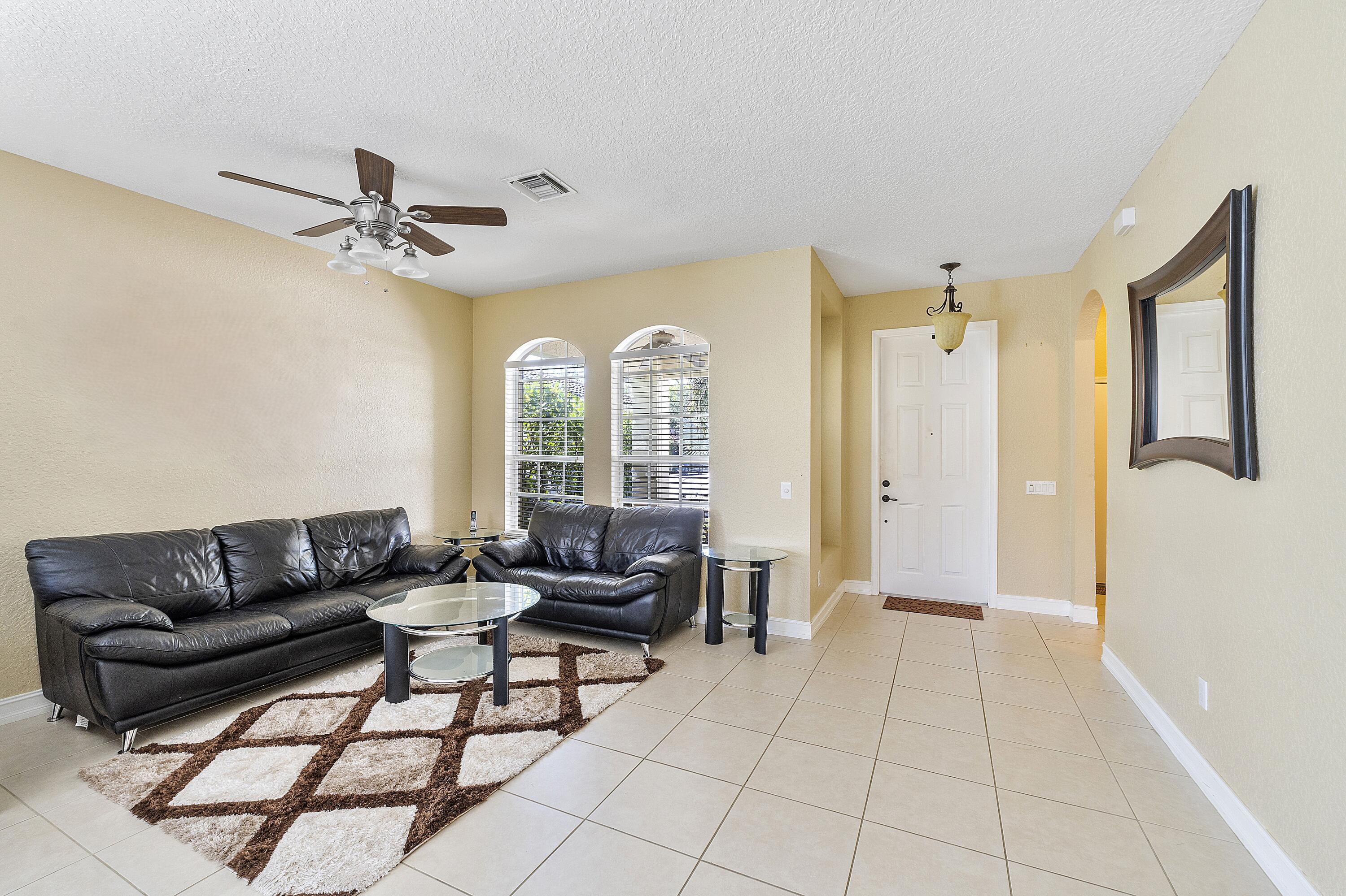 8936 Chestnut Ridge Way Boynton Beach, FL 33473 - Photo 6 of 50 Family room back towards Entry foyer