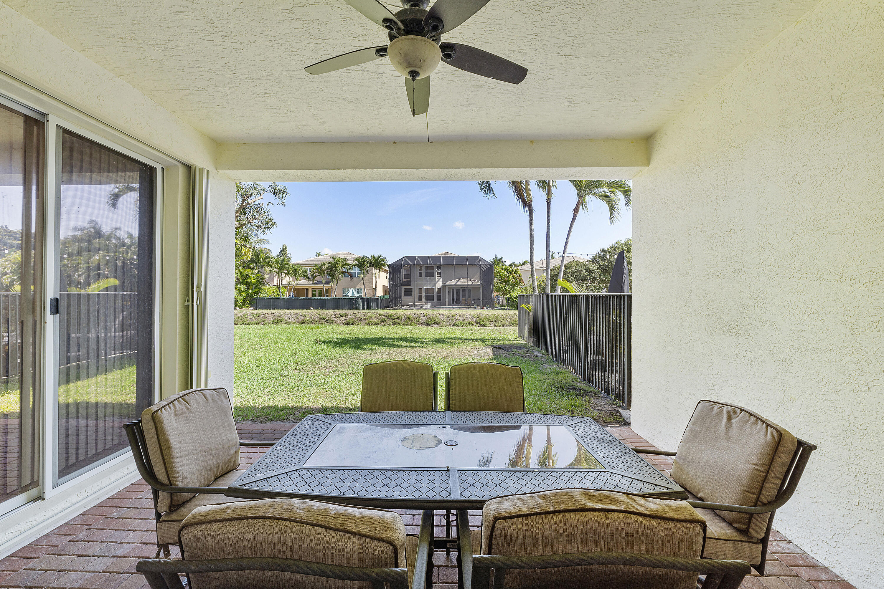8936 Chestnut Ridge Way Boynton Beach, FL 33473 - Photo 8 of 50 Exterior rear covered patio area w table