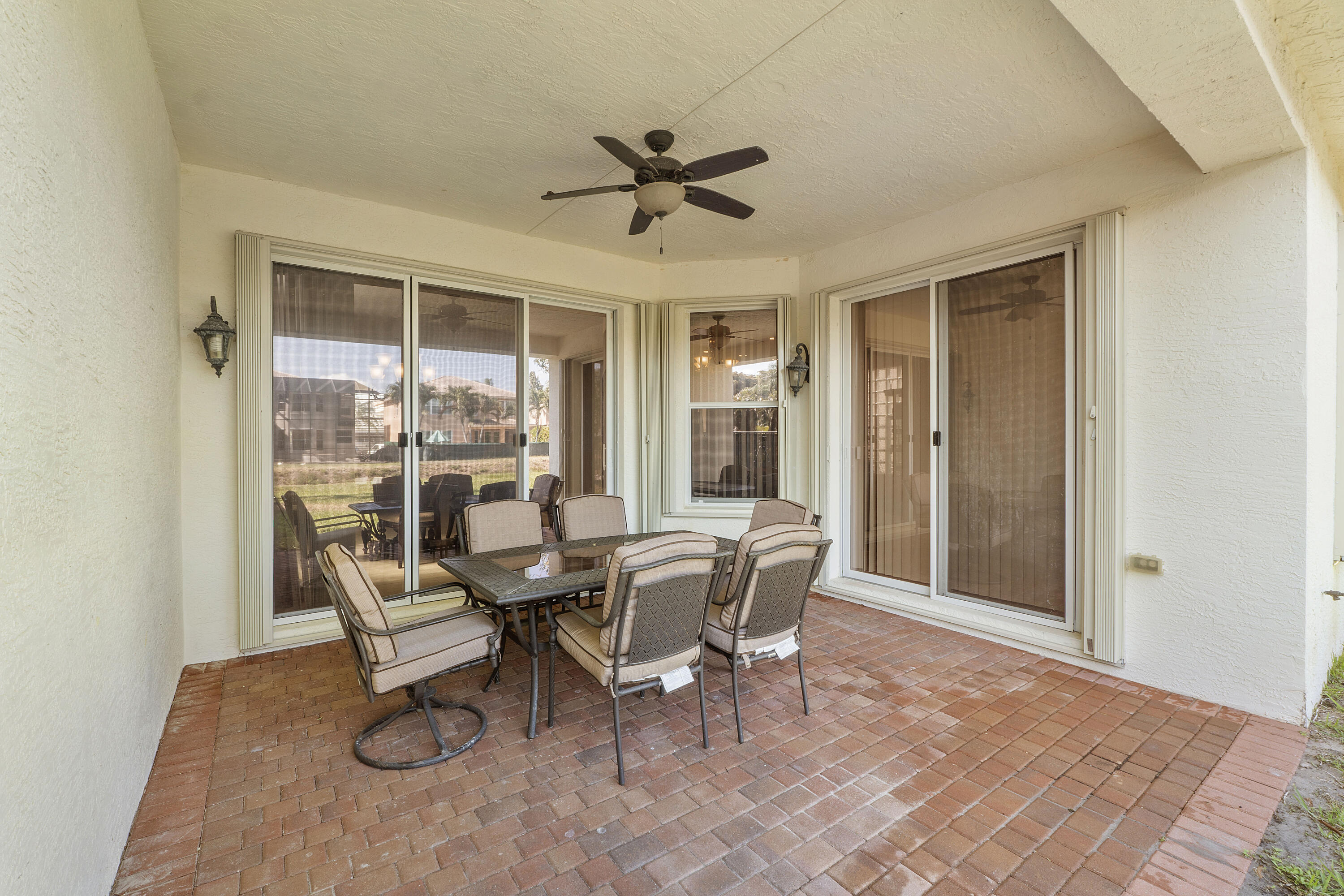 8936 Chestnut Ridge Way Boynton Beach, FL 33473 - Photo 9 of 50 Exterior Rear covered Patio Area w table