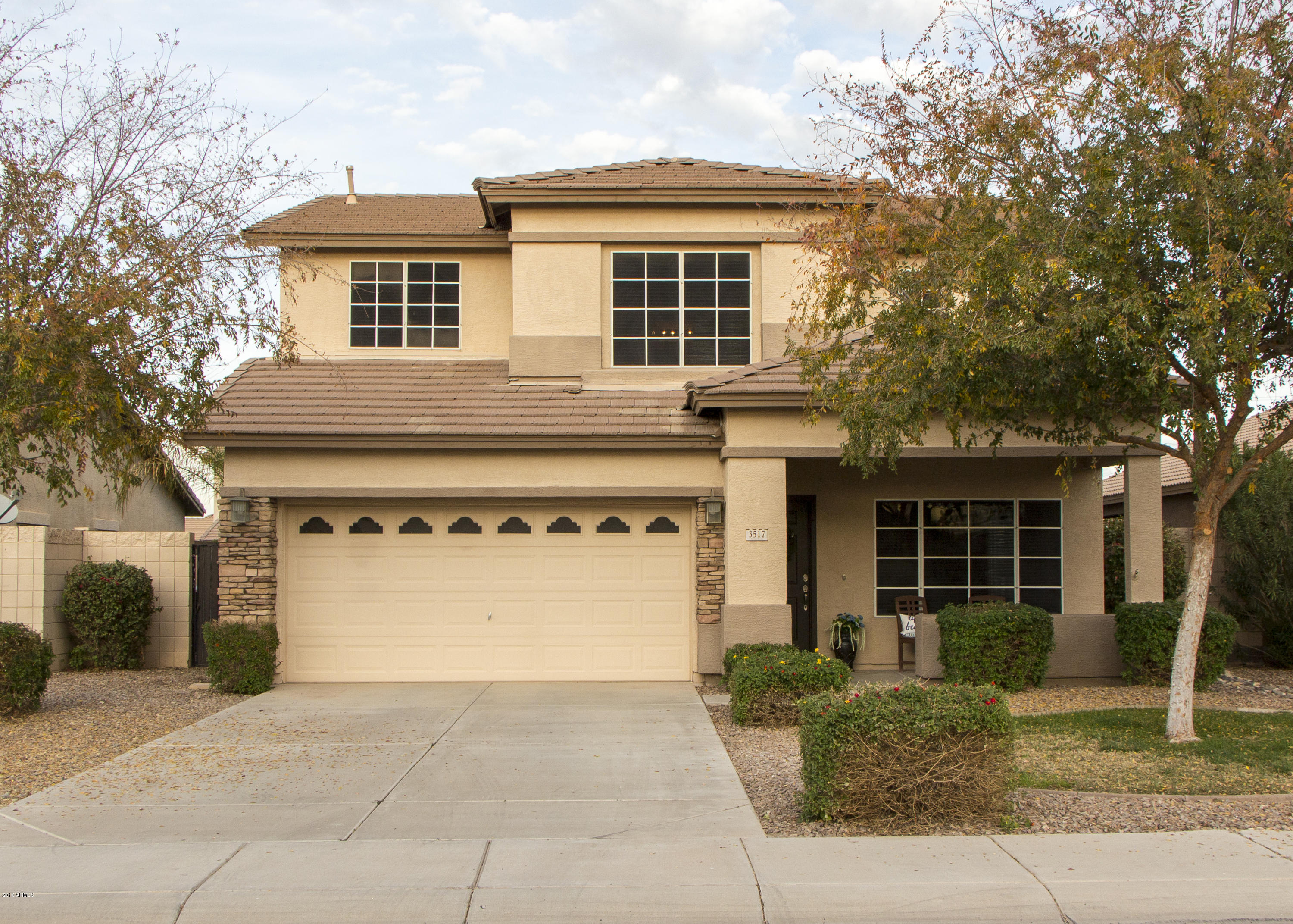 3517 South Sawmill Road Gilbert, AZ 85297 - Photo 1 of 26 a front view of a house with a yard and garage