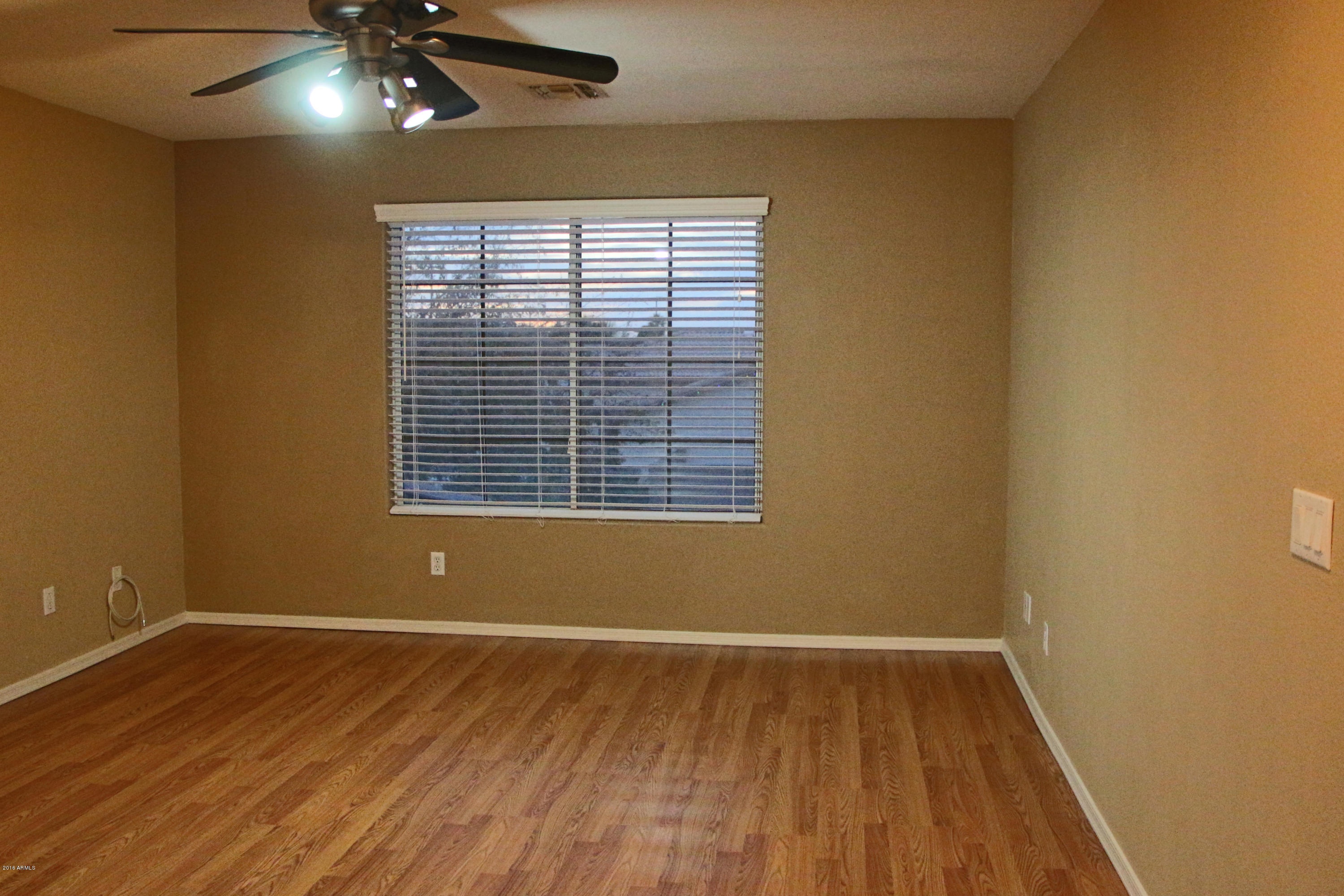 3517 South Sawmill Road Gilbert, AZ 85297 - Photo 13 of 26 a view of wooden floor and windows in a room