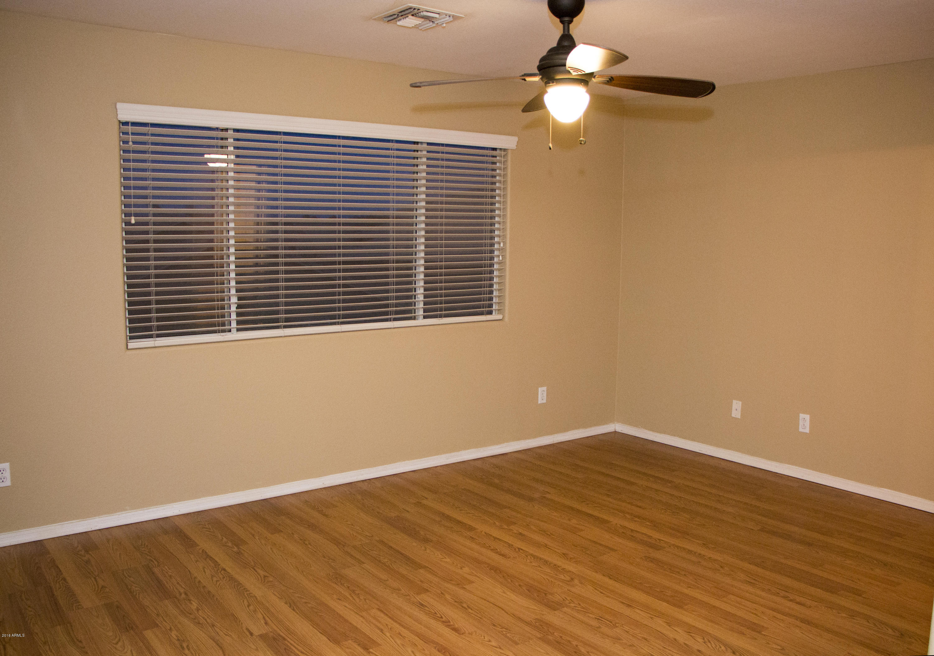 3517 South Sawmill Road Gilbert, AZ 85297 - Photo 14 of 26 a view of empty room with wooden floor and fan