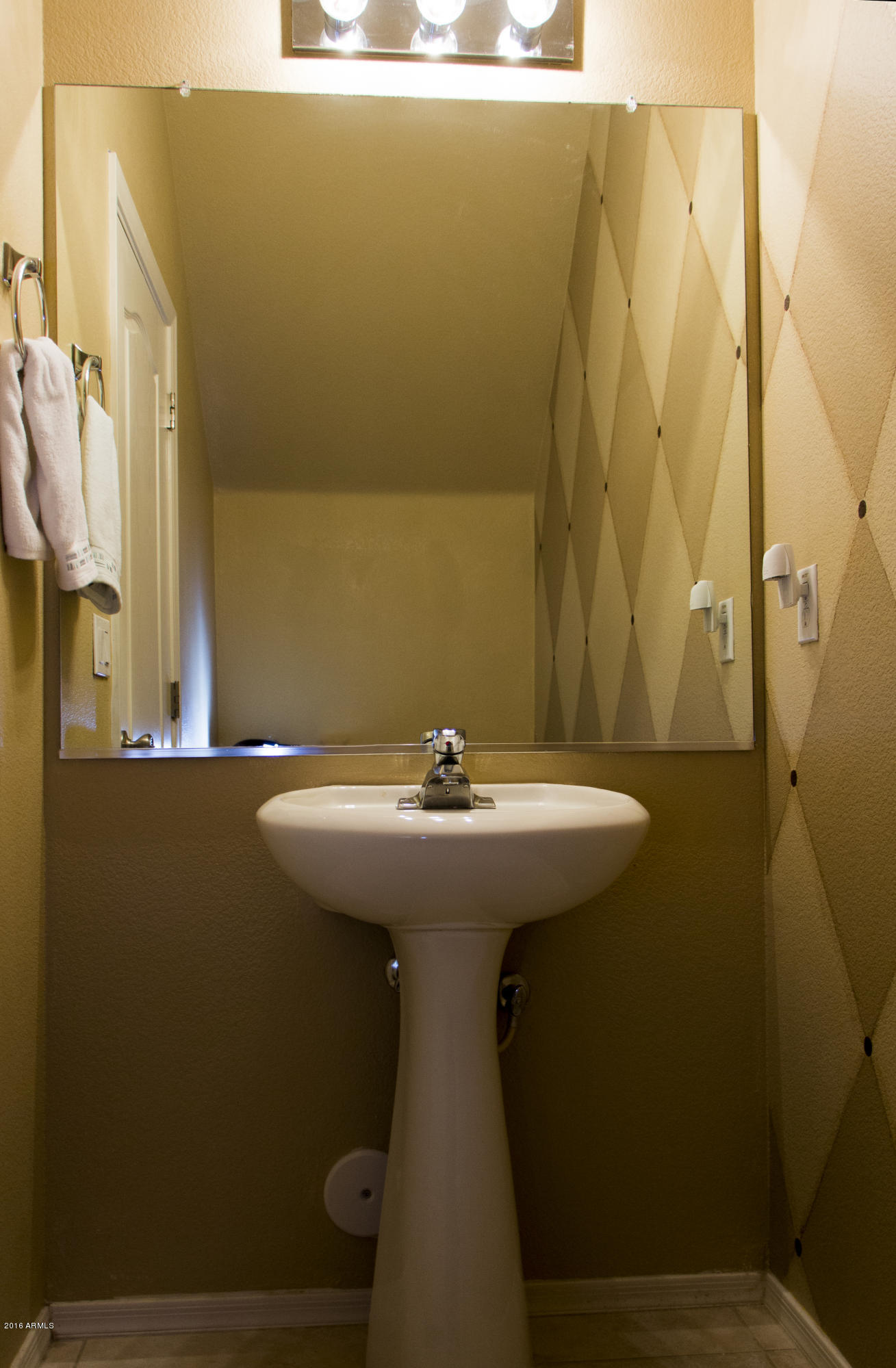 3517 South Sawmill Road Gilbert, AZ 85297 - Photo 23 of 26 a bathroom with a sink and mirror