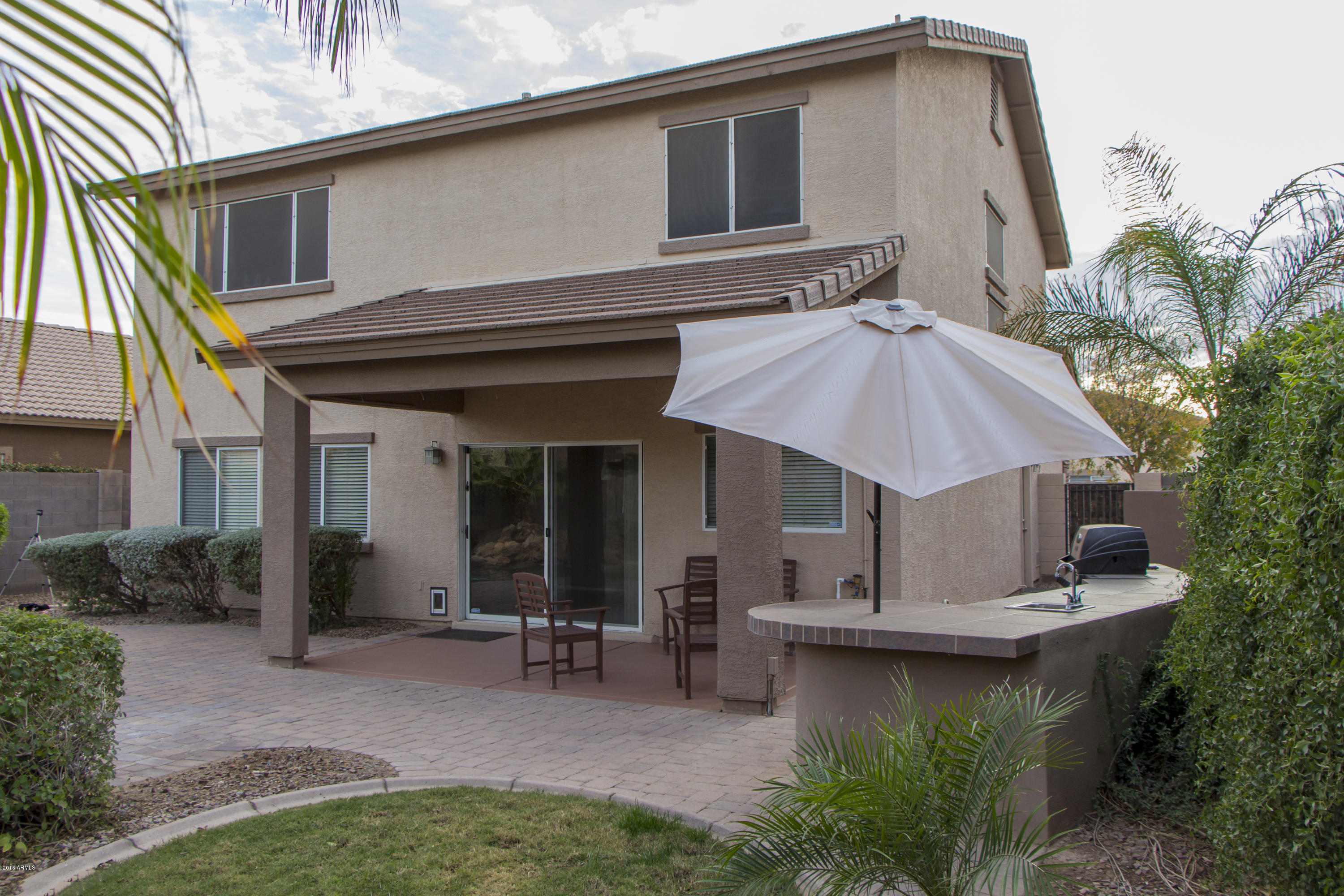 3517 South Sawmill Road Gilbert, AZ 85297 - Photo 5 of 26 a view of a house with pool and chairs
