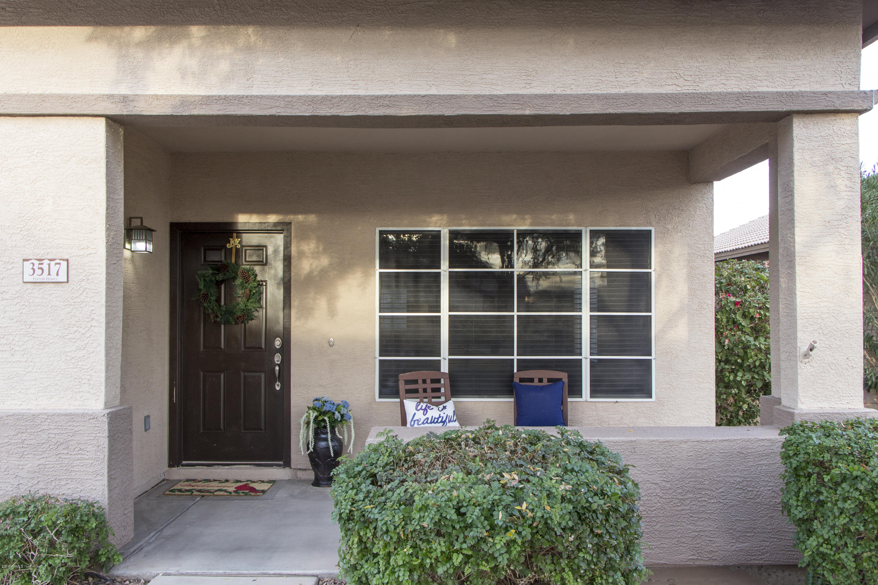 3517 South Sawmill Road Gilbert, AZ 85297 - Photo 7 of 26 a front view of a house with a yard